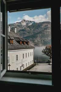 a view from a window of a building with a mountain at Appartement no8 in Sankt Gilgen