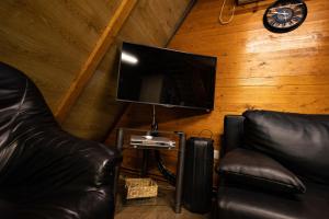TV a/nebo společenská místnost v ubytování City Break