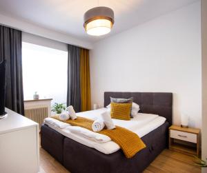 Postel nebo postele na pokoji v ubytování Bethlen Apartman