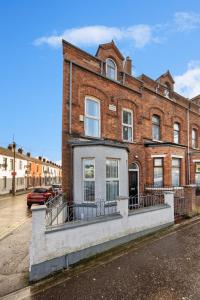 a large brick building on the side of a street at Clondara Terrace Belfast in Belfast
