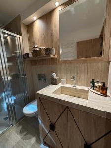 a bathroom with a sink and a shower at Appartamento nuovo Sankt Moritz Chesa arlas 3B in St. Moritz +44 photos