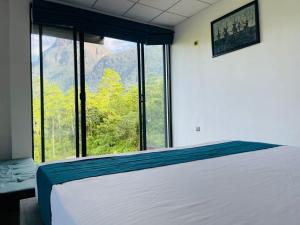 Postel nebo postele na pokoji v ubytování Palabaddala Tea and Eco Lodge