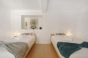 En eller flere senge i et værelse på The Yellow House