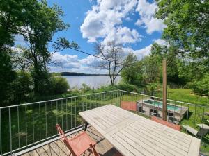 a deck with a view of a lake at LaRiviere in Asques