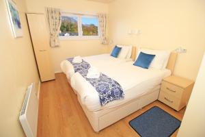 Ένα ή περισσότερα κρεβάτια σε δωμάτιο στο River's Edge Penthouse