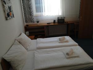 A bed or beds in a room at Skalka