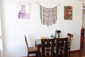 a dining room with a table and chairs at Don Andre House in Cusco