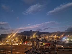 a view of a city at night with lights at Casa Sharlen in Hacienda El Tambo