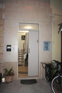 a door to a room with bikes parked next to it at Sweet Home Tempo Libero in San Severo