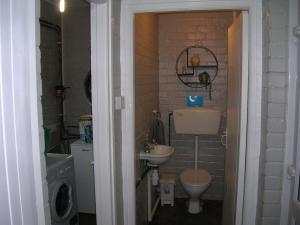 a small bathroom with a sink and a toilet at Bevan House with Hot Tub in Mid-Wales in Hundred House +20 photos
