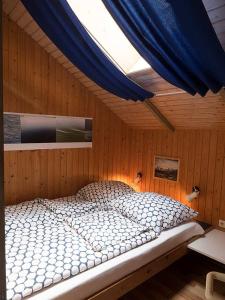Ein Bett oder Betten in einem Zimmer der Unterkunft Ferienhaus "Sören"