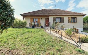 a small house with a yard in front of it at Maison des viennes in Saint-André-les-Vergers