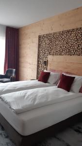Postel nebo postele na pokoji v ubytování Hotel Steinmattli