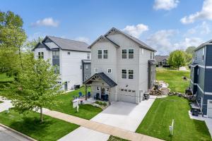 an aerial view of a house with a yard at Toes in the Water , pool , perfect for large groups in South Haven