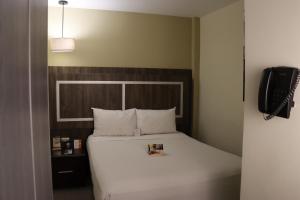 Postel nebo postele na pokoji v ubytování Rado Hotel - Santa María
