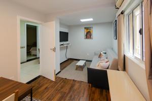 Μια τηλεόραση ή/και κέντρο ψυχαγωγίας στο Prime Inn - Guest-House Coração Eucarístico