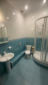 Koupelna v ubytování Viva Hotel