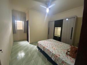 En eller flere senge i et værelse på Sítio - Contagem