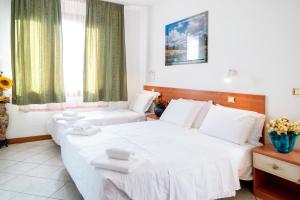 Posteľ alebo postele v izbe v ubytovaní Hotel New Aurora Venice