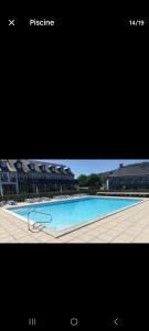 a picture of a swimming pool with a picture at Chez Anne WIFI dans le logement in Argentat