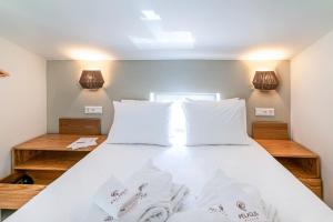 Postel nebo postele na pokoji v ubytování Pelagus Luxury Villas