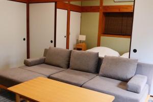 Posezení v ubytování 島宿屋久島
