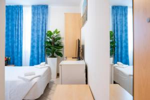 Posteľ alebo postele v izbe v ubytovaní Hotel New Aurora Venice