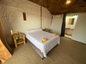 a bedroom with a bed in a tent at Guajira Beach in Ríohacha