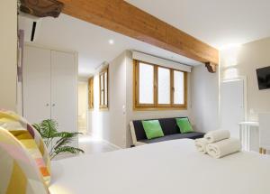 Ένα ή περισσότερα κρεβάτια σε δωμάτιο στο Apartamentos RyC