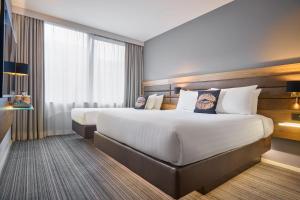 Voodi või voodid majutusasutuse Moxy Dublin City toas