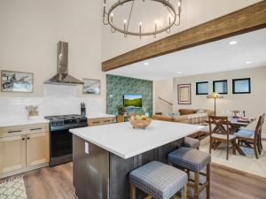 a kitchen and living room with a table and chairs at 4BD Home - Games - Close to Downtown & Snowbowl in Flagstaff