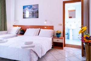 Posteľ alebo postele v izbe v ubytovaní Hotel New Aurora Venice