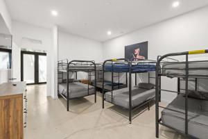 a group of bunk beds in a room at Rainbow Motel Miami in Miami