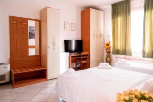 Posteľ alebo postele v izbe v ubytovaní Hotel New Aurora Venice
