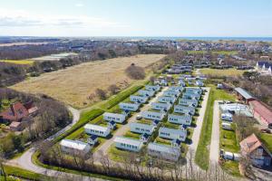 an aerial view of a parking lot with trailers at Chalet Luttikduin Nr 22 - Callantsoog aan Zee in Callantsoog