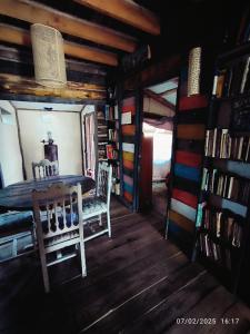a dining room with a table and chairs in a cabin at Rancho lagarto in Punta Del Diablo +19 photos
