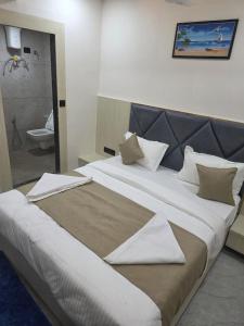 Postel nebo postele na pokoji v ubytování hotel hill top