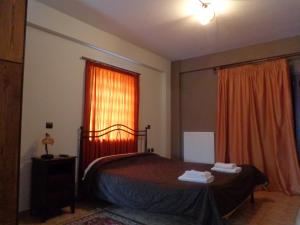 Postel nebo postele na pokoji v ubytování Alonaki Guesthouse