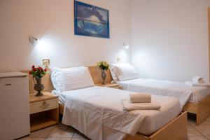 Posteľ alebo postele v izbe v ubytovaní Hotel New Aurora Venice