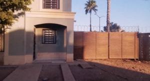 a house with a garage and a fence at Eduardog in Ciudad Obregón