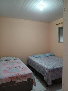 a room with two beds in a room at Apartmento ótima localização ! in Garanhuns