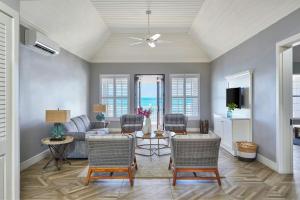 a living room with a couch and chairs at French Leave Resort, Autograph Collection in Governorʼs Harbour