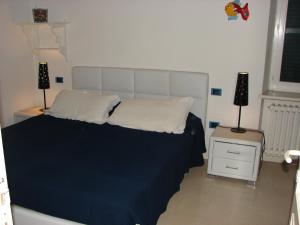 Кровать или кровати в номере La Casina delle Fate