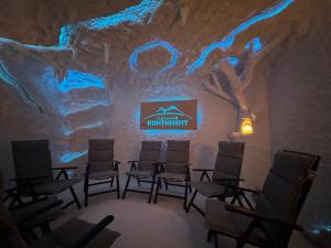 a room with a group of chairs in a ice cave at "Гірський Континент" Hotel Restaurant & SPA in Yablunytsya