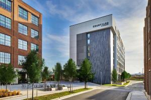 an artist rendering of a rendering of a building at Courtyard Baltimore Downtown/McHenry Row in Baltimore