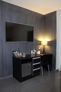TV a/nebo společenská místnost v ubytování Rado Hotel - Santa María