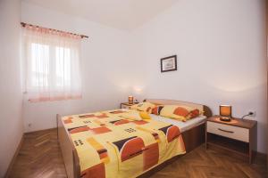 Postel nebo postele na pokoji v ubytování Apartments Renata