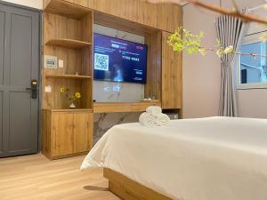 Postel nebo postele na pokoji v ubytování 6even Apartments - Phố đi bộ Nguyễn Huệ