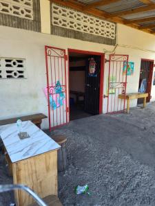 a building with two doors and benches in front of it at BBV Properties in Belmont