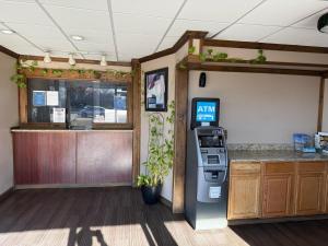 an atm machine in a room next to a counter at Relax Inn in Hampton
